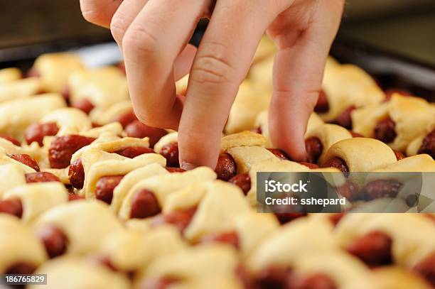 Selecting Pig In A Blanket Stock Photo - Download Image Now - Buffet, Reaching, Choosing