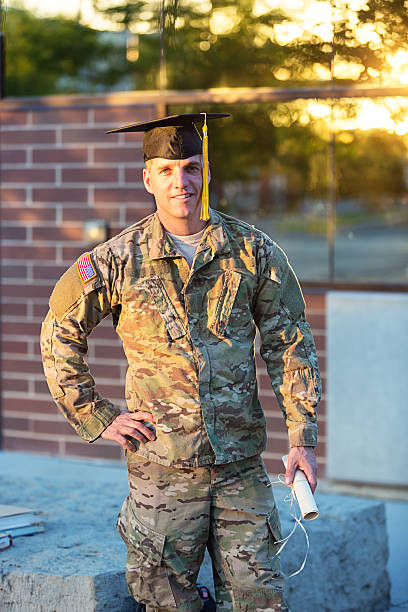 istock American Soldier with graduation hat 186765861