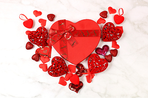 Celebration of Valentine's Day or Women's Day, Mother's Day, banner. Greeting card, set of red hearts on a marble background, congratulations on the holiday, birthday, selective focus