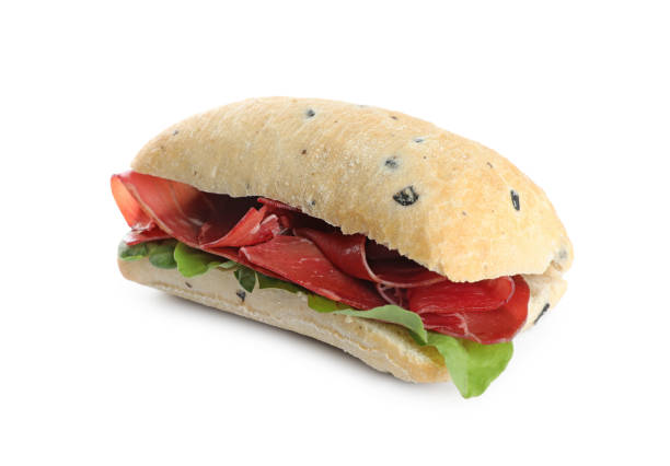 istock Delicious sandwich with bresaola and basil isolated on white 1867667703