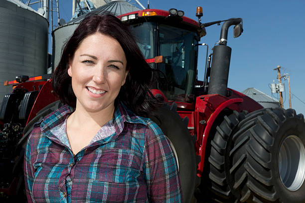 istock Female Farmer and Tractor 186767350