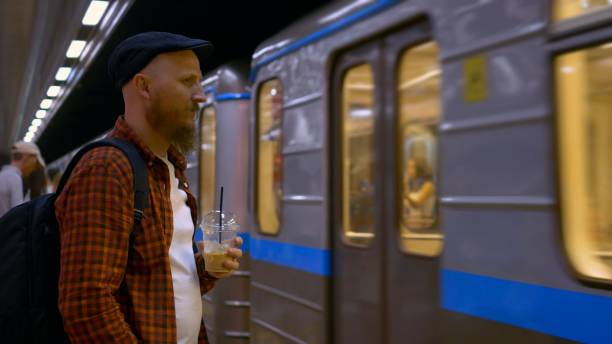 istock Metro train arrives platform, man coffee stands, transportation technology. integration technology daily commuting, station, advancements transportation technology efficient urban travel. 1867679075