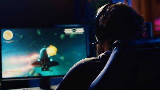 istock Gamer chatting with teammates while navigating universe in coop game 1867682681