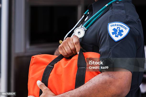 Paramedic Holding Medical Bag Stock Photo - Download Image Now - Paramedic, Ambulance, Emergency Services Occupation