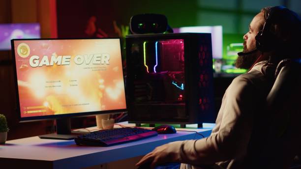istock Man upset after losing while playing online multiplayer spaceship videogame 1867688886
