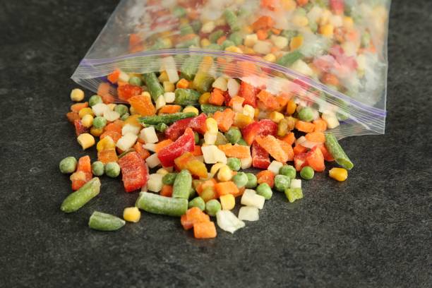 istock Zip bag with different frozen vegetables on grey table, closeup 1867695248