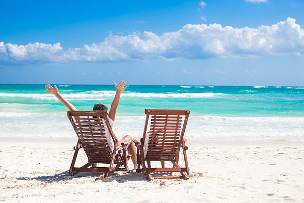 istock Young father with little daughter in beach chairs 186769741