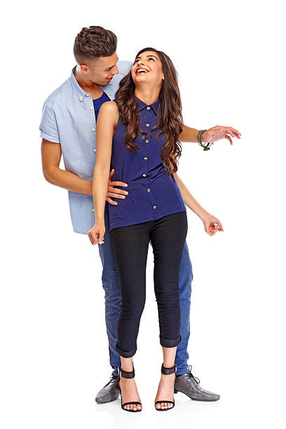 istock Cheerful young couple dancing together on white 186770449