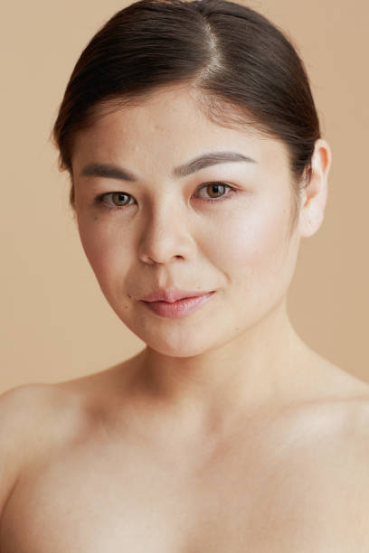 istock young asian female looking in camera 1867713465