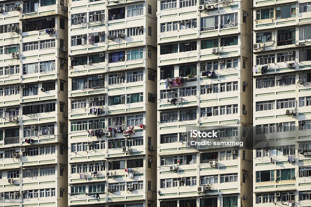 Apartment Building in Hong Kong Hong Kong is one of the most densely populated places in the world.  Air Conditioner Stock Photo