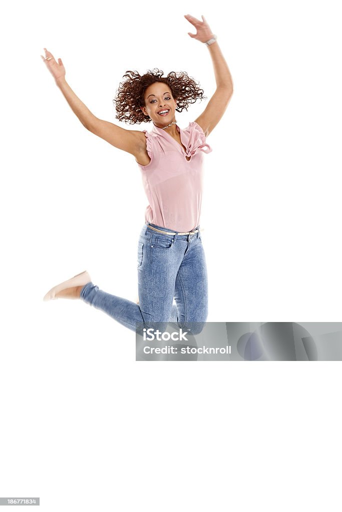 Excitación joven saltar en el aire - Foto de stock de Felicidad libre de derechos