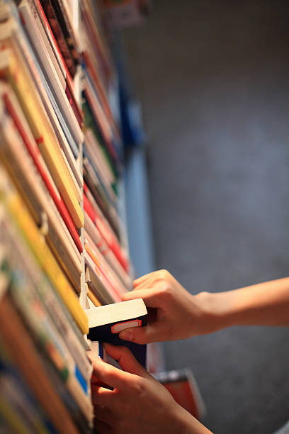 istock Girl Picking Books 186771873