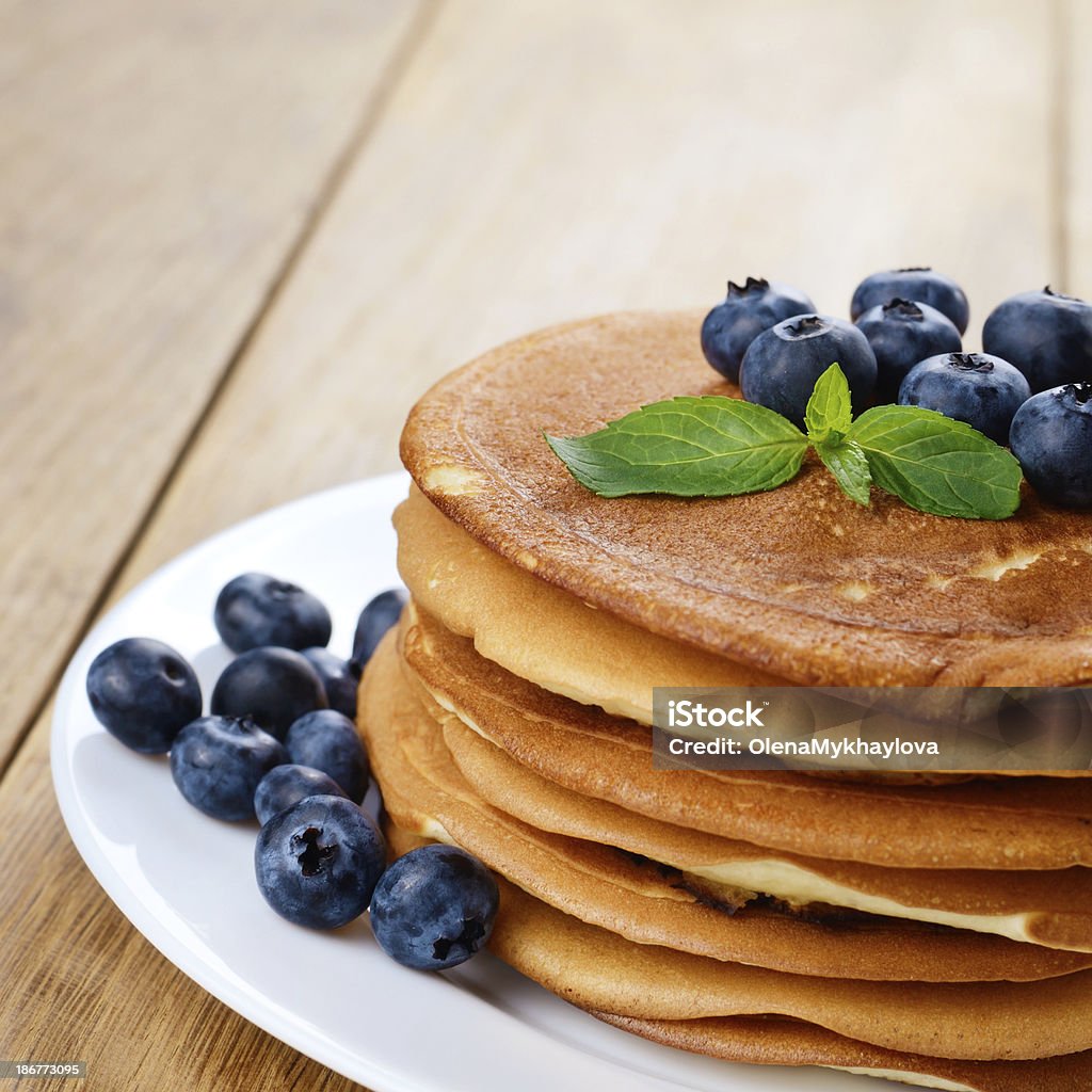 Ready to eat pancakes Ready to eat pancakes with blueberries on the white plate Baked Pastry Item Stock Photo
