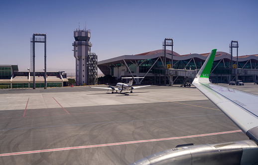 Passenger plane on airport parking. Copy space.