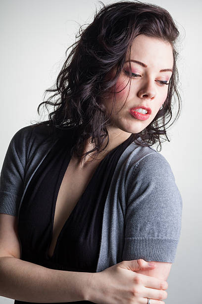 istock Brunette Looking Seductively Over Her Shoulder 186773164