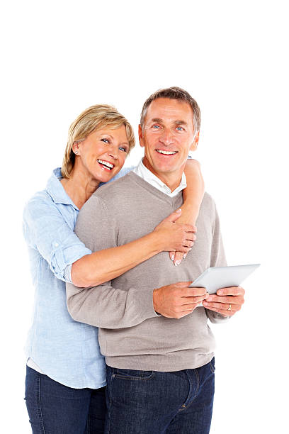 istock Cheerful mature couple with a digital tablet 186774185