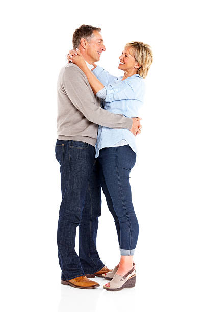 istock Happy mature couple in love standing on white 186774215