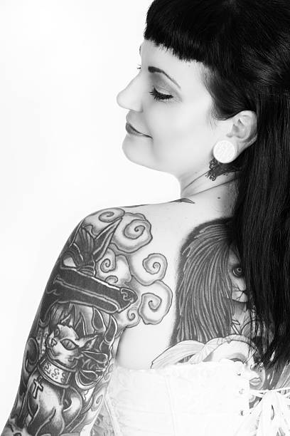 istock B&W rear view profile of daydreaming pinup. 186774460