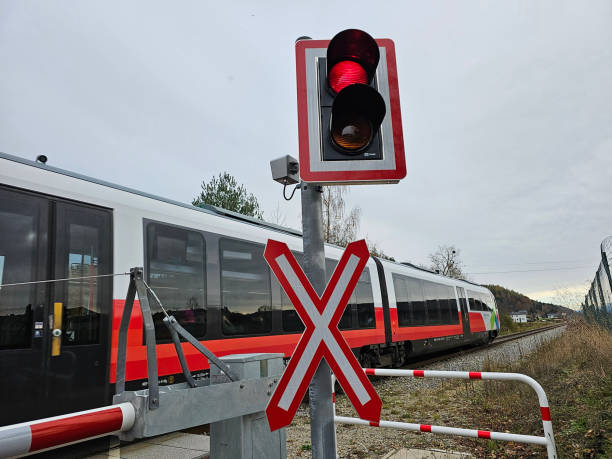 Red light at a train crossing stock photo