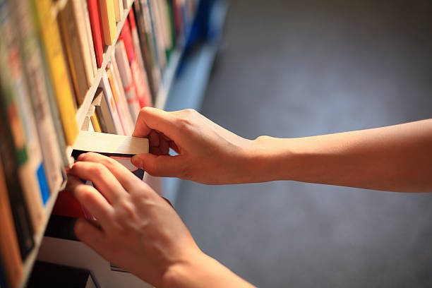 istock Girl Picking Books 186774756