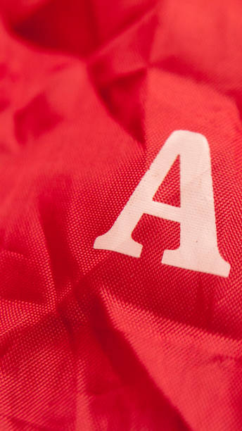 istock Letter A on wrinkled red plastic fabric 1867751388