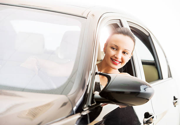 istock Smiling woman driving a car. 186775850