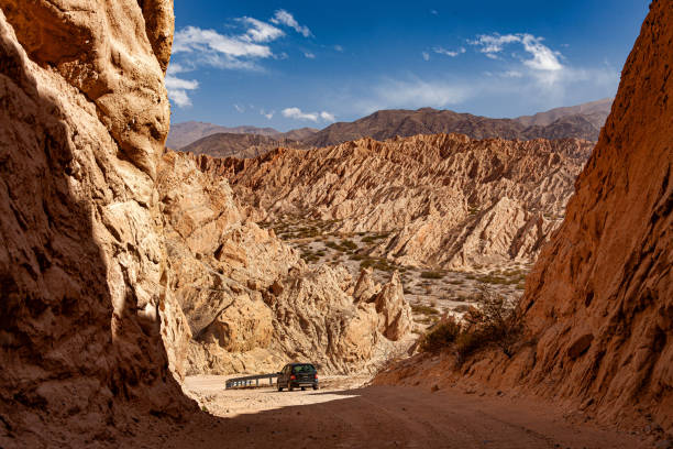 istock Dirt road with car passing through the Quebrada de las Flechas in Argentina. 1867761305