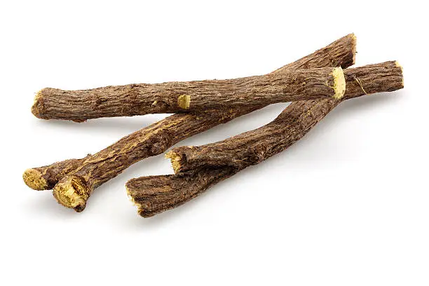 Dried licorice root on a white background