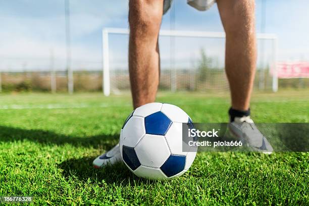 Soccer Player On The Football Pitch Stock Photo - Download Image Now - Adult, Cleats, Close-up