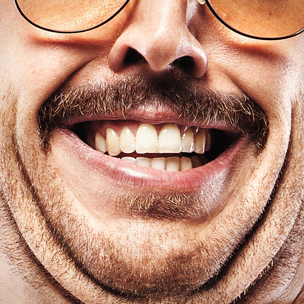 Gross Mustache Face Closeup An overly close portrait of a 1970's man with a mustache, a double chin, and a sleazy smile.  Square crop. fat ugly face stock pictures, royalty-free photos & images