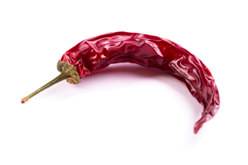 red dry chili pepper on white background