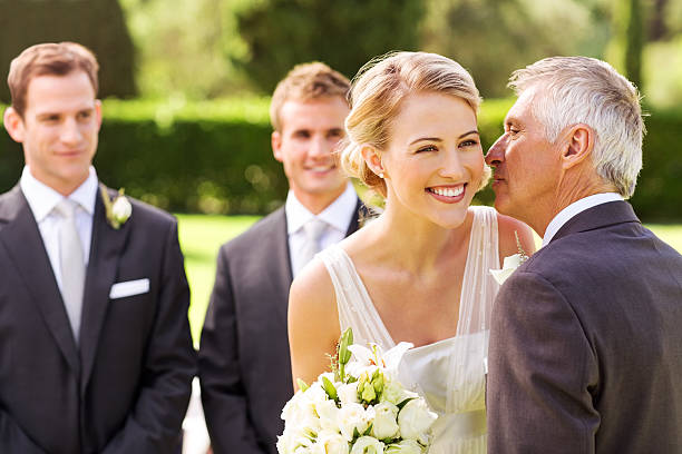 istock Father Kissing Bride On Cheek During Wedding Ceremony 186776982