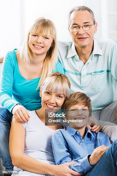 Embraced Family At Home Stock Photo - Download Image Now - Adolescence, Adult, Beautiful People