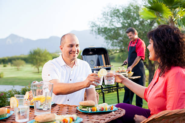 istock Cheerful friends toasting and eating 186778527