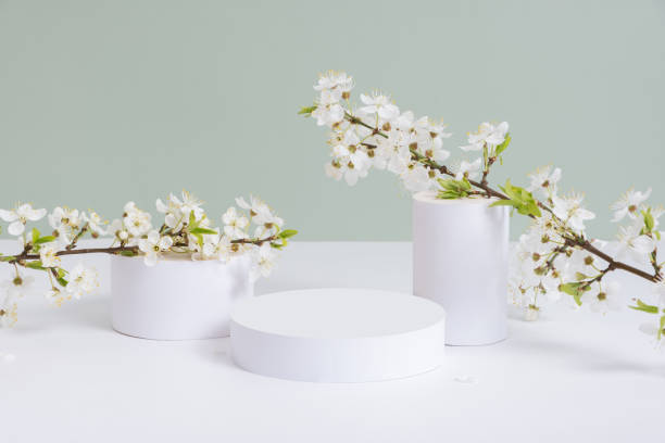istock Empty podium or pedestal with spring bloom. Mock up for cosmetic products 1867794966