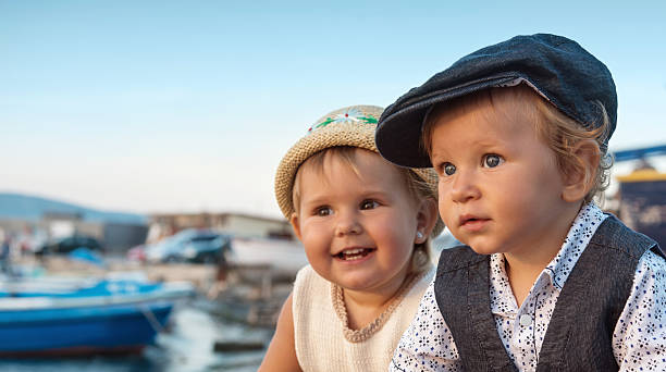 два милый дети - fishing boat стоковые фото и изображения