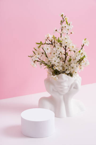 istock Empty podium or pedestal with spring bloom. Spring mock up for cosmetic products 1867796022