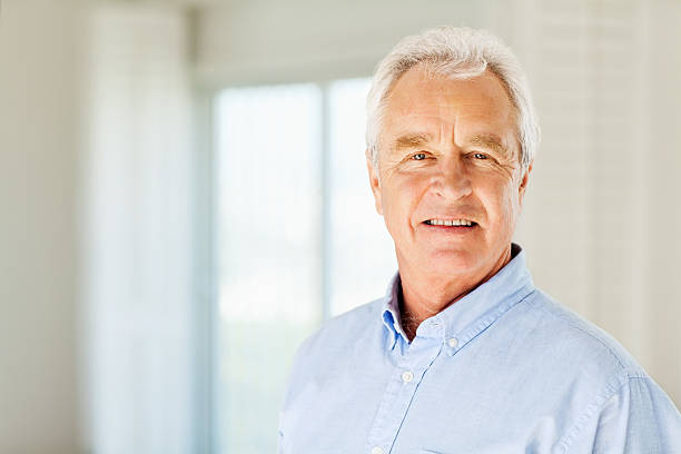 istock Confident Senior Man Smiling At Home 186781144