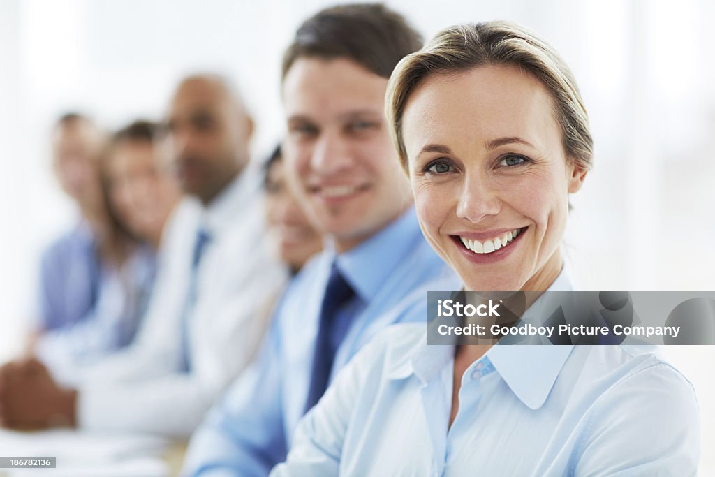 She loves her team! Smiling businesswoman in a meeting with her coworkers 30-39 Years Stock Photo