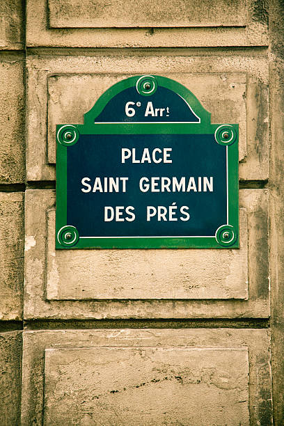 Paris St-Germain des pres street sign on old stone wall.