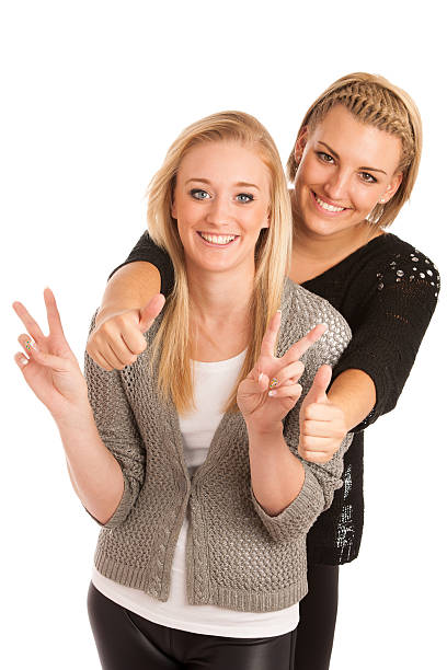 istock Two beautiful women gesturing success 186783471