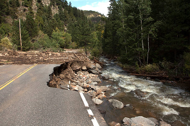 In Boulder, Colorado's Left Hand Canyon landslides cover the road as the flooding Left Hand Creek undercuts and erodes the pavement after days of heavy September rains.