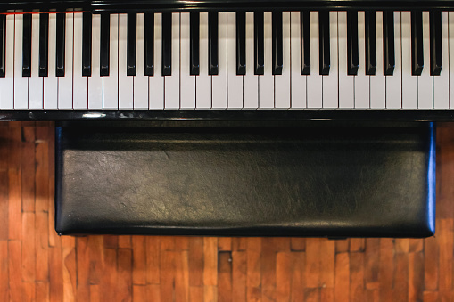 Beautiful piano background are set by the window in the morning waiting for the pianist to come to practice in the morning to reduce the mistake of having to perform the piano performance at a concert