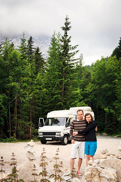 istock young couple travelling with their caravan 186788496