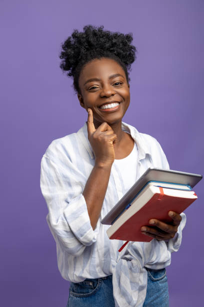 istock Smiling cute dark-skinned woman generating new ideas 1867890691