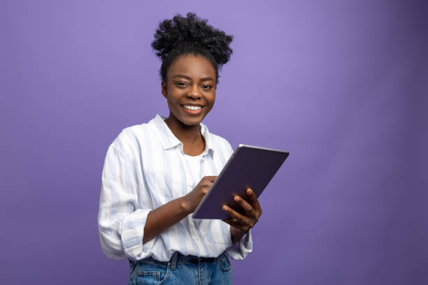 istock Smiling cute dark-skinned woman generating new ideas 1867890692