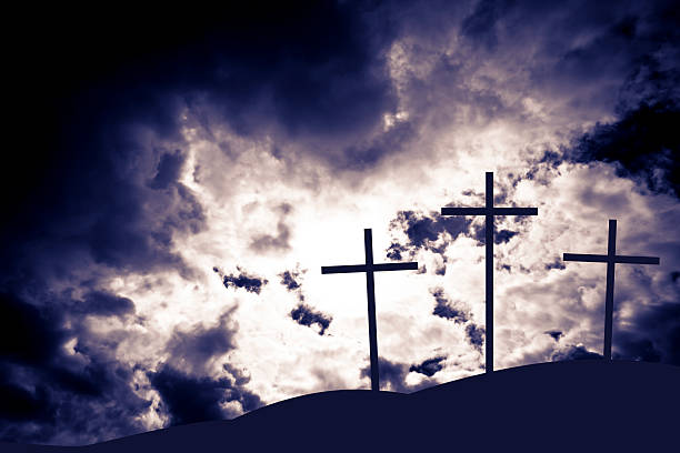 istock The Crucifixion silhouette with stormy sky 186790451
