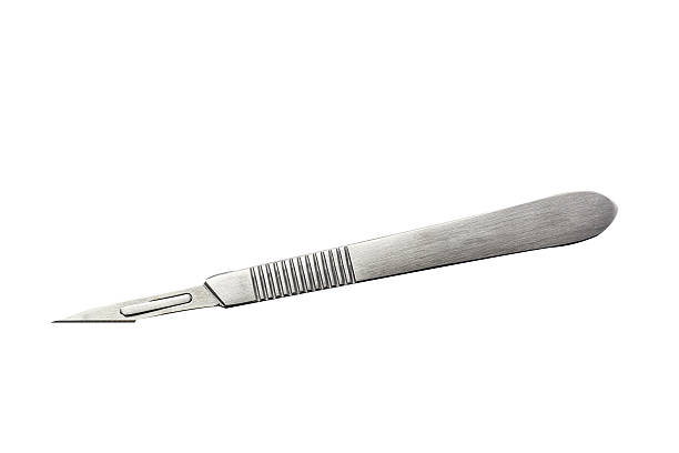 Silver scalpel on plain white background scalpel on the white background with  clipping path scalpel photos stock pictures, royalty-free photos & images