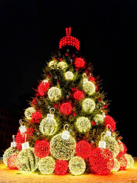 istock A gorgeous big Christmas tree with illuminations in the town square at night 1867925768
