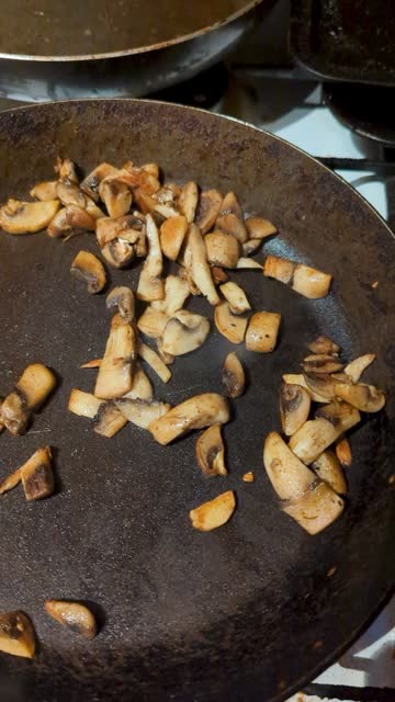 Sliced Mushroom frying in a pan